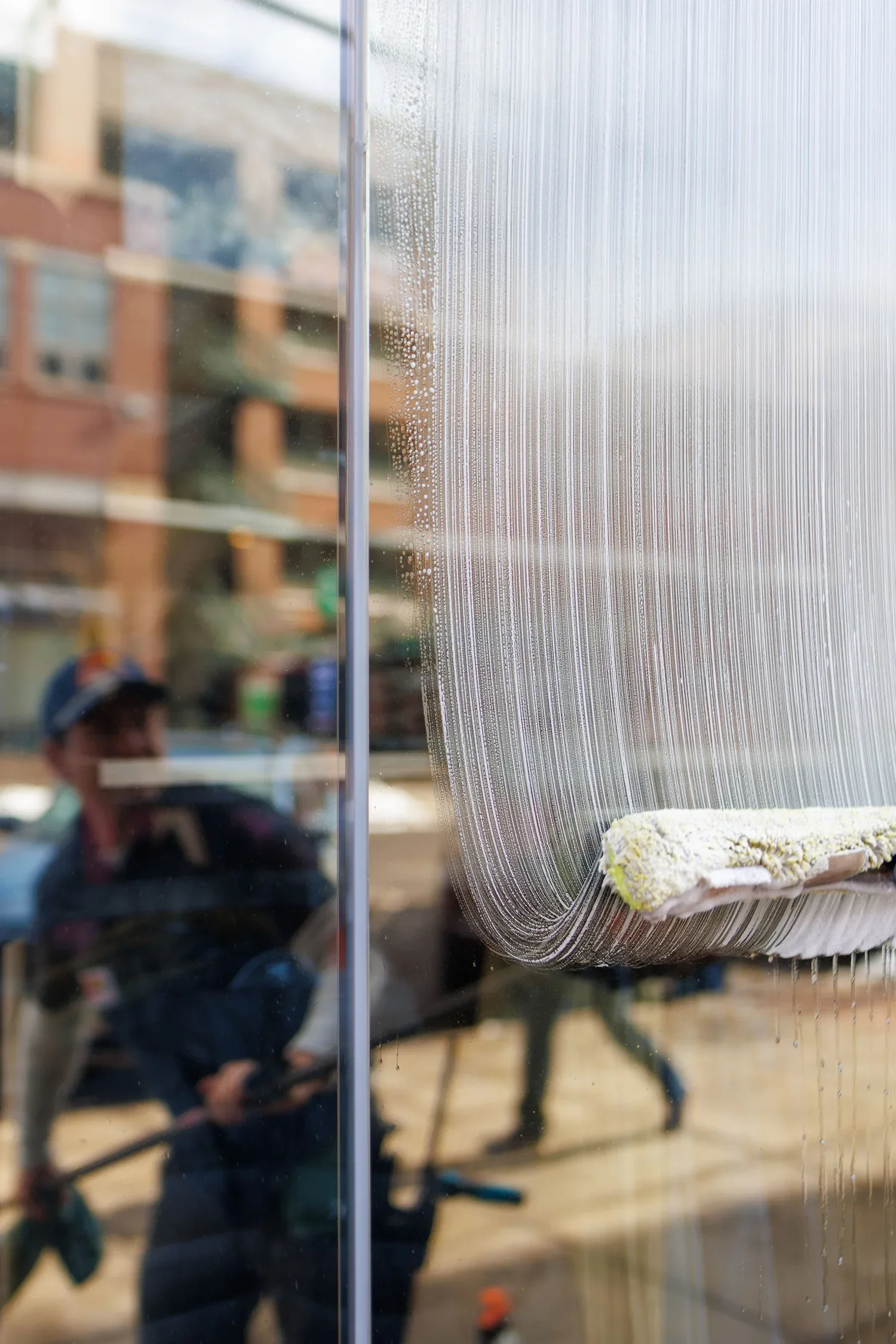 Clean windows on a Pearl Street Boulder restaurant storefront