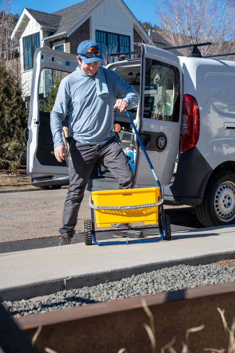 Max from Happy Glass unloading yellow bucket from work van near Superior, Colorado