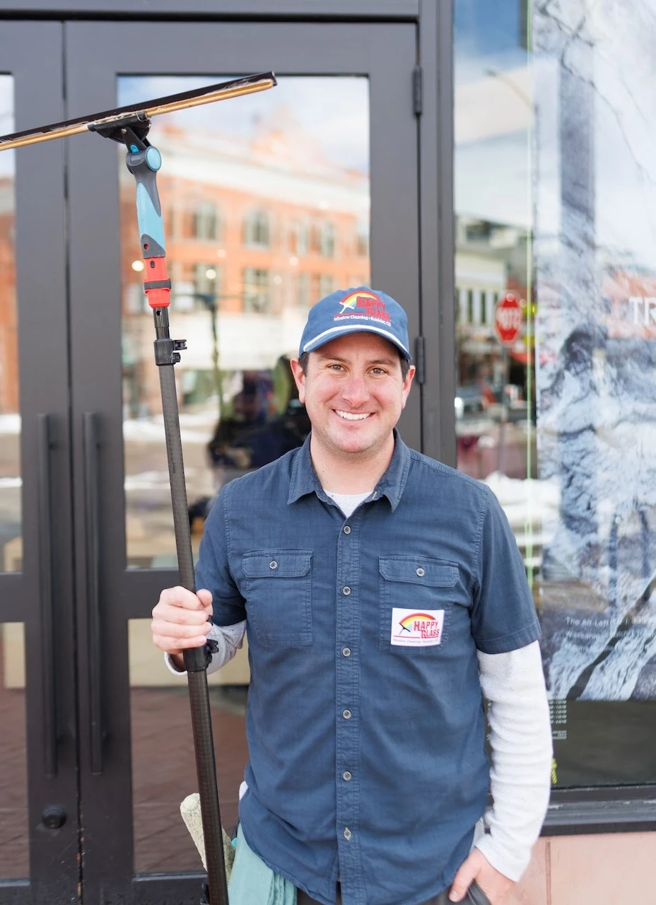 Happy Glass worker portrait with squeegee